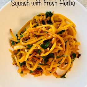 A white bowl filled with spiralized butternut squash noodles.