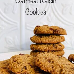 A pile of oatmeal cookies on a white plate.