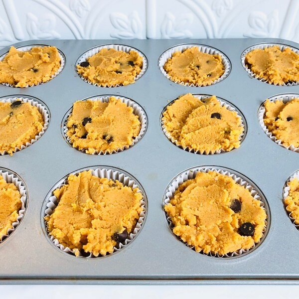 Muffin batter in a metal pan.