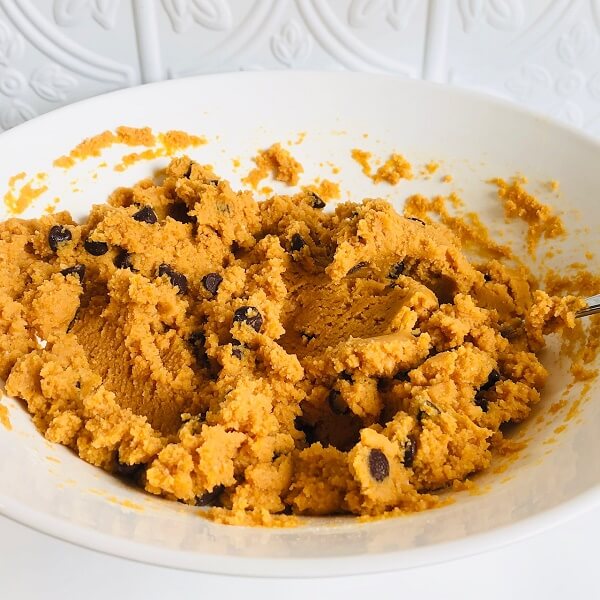Raw muffin batter in a large white mixing bowl.
