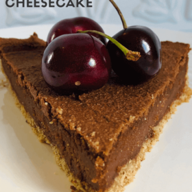 Pinterest image of a slice of cheesecake on a white plate.