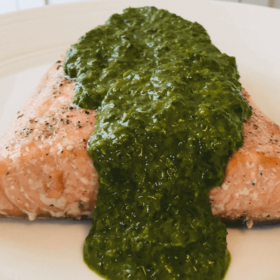 Pinterest image of green sauce on a filet of trout.