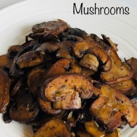 A pile of cooked mushrooms on a white plate.