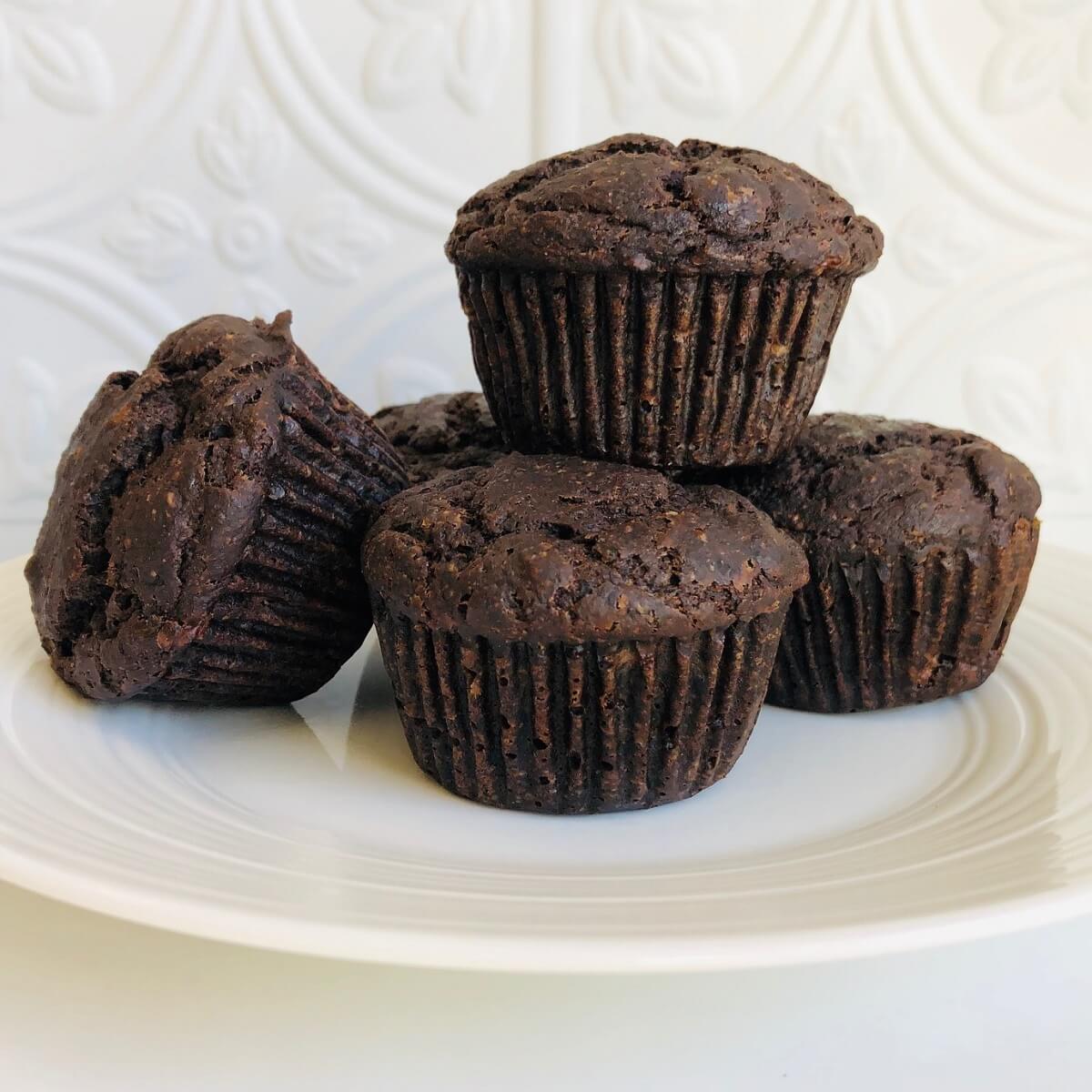 Buckwheat flour muffins displayed on a white plate.