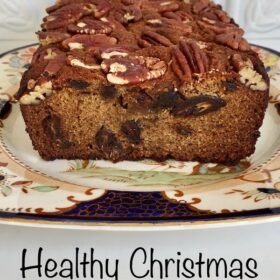 Christmas cake on a plate against a white background.