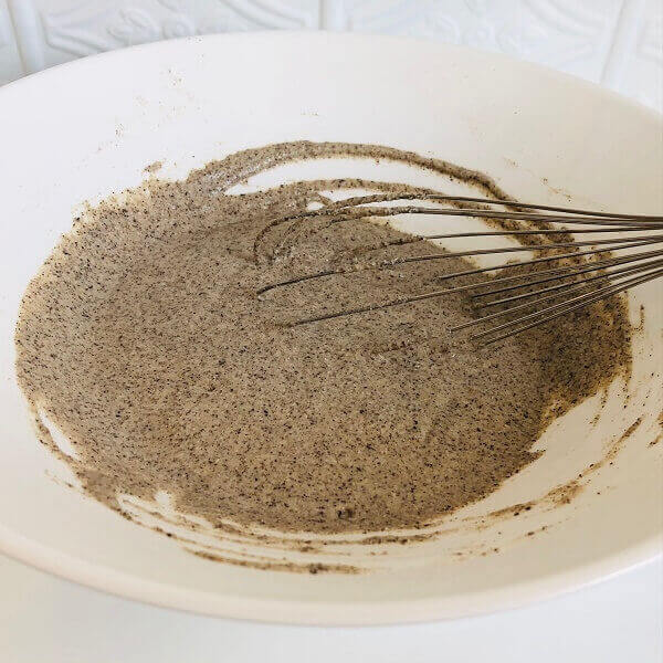 Buckwheat pancake batter in a white bowl.