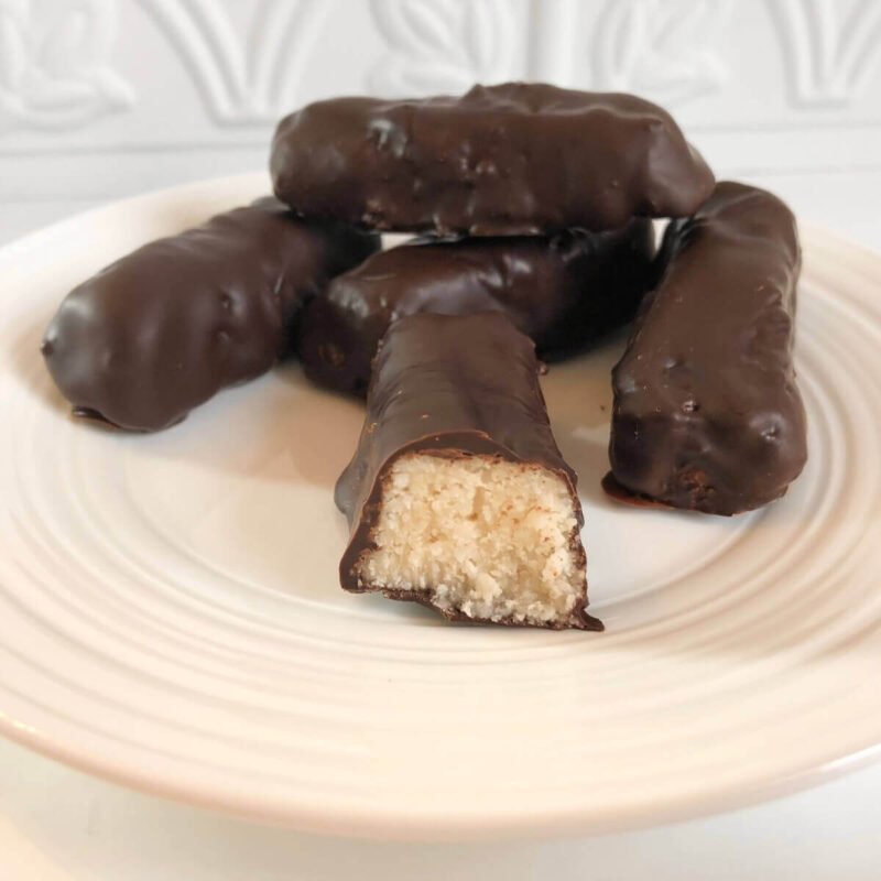 Chocolate coconut bars displayed on a plate.