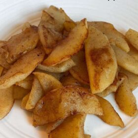 Cooked apples on a plate.