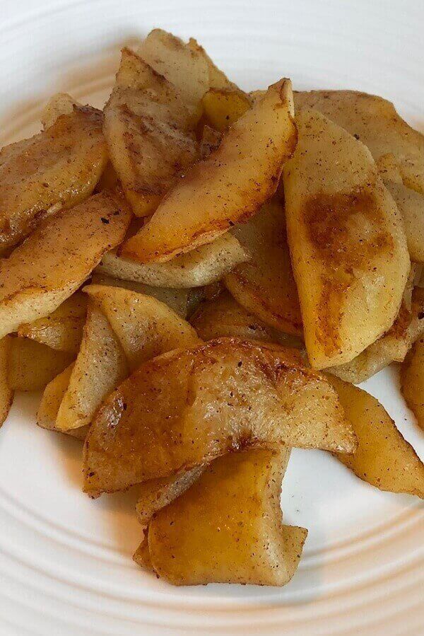 Sauteed apples on a plate.