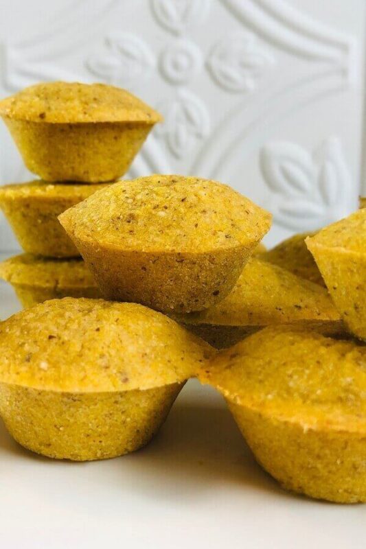 Cornbread muffins displayed on a plate.