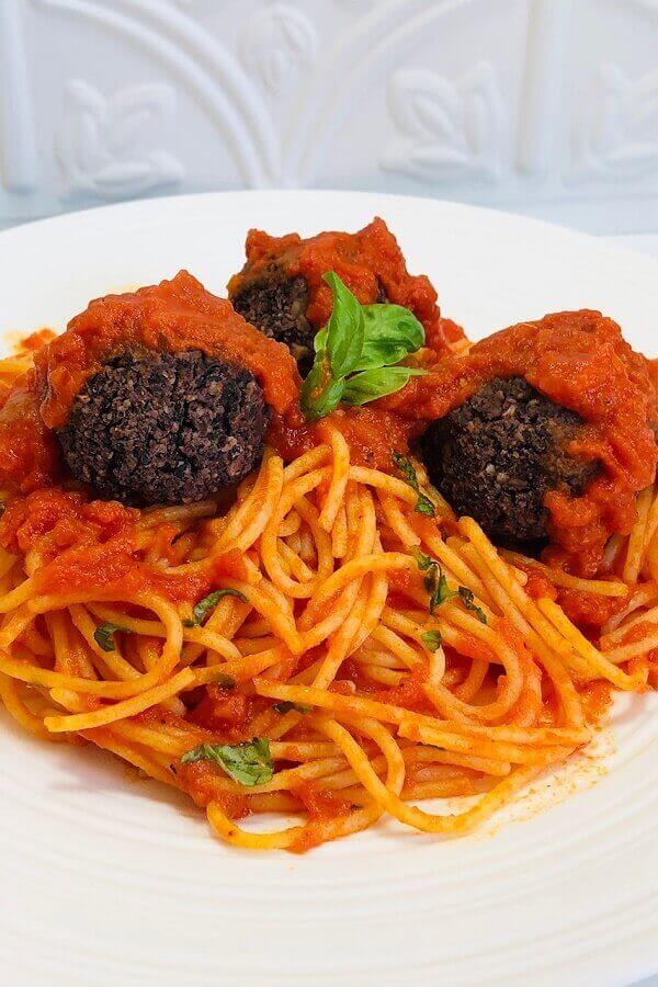 Meatballs and pasta on a plate.