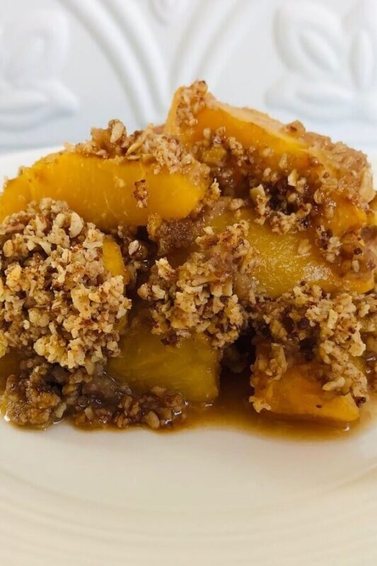 Peach crisp on a plate.