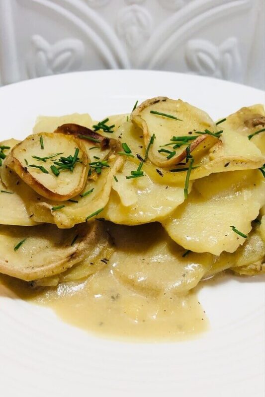 Scalloped potatoes on a plate.