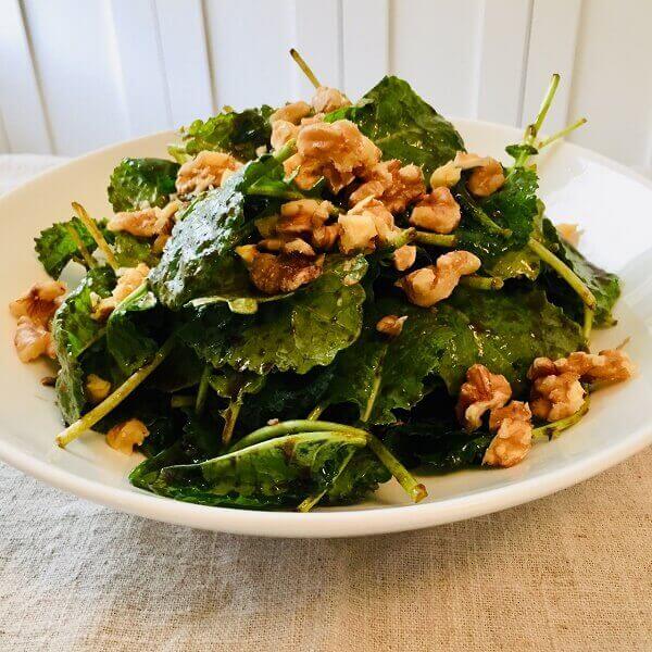 Salad in a white bowl.