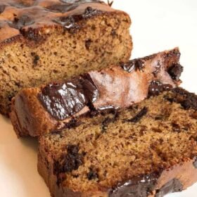 Sliced banana bread with chocolate chunks.