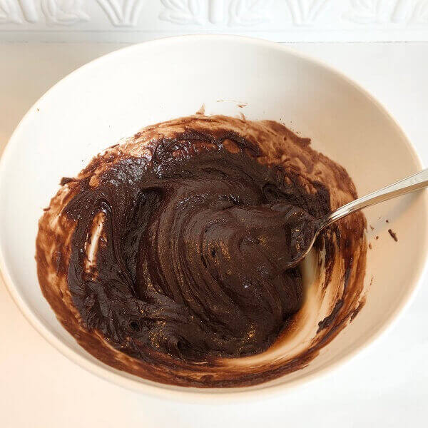 Chocolate mixture in a white bowl.