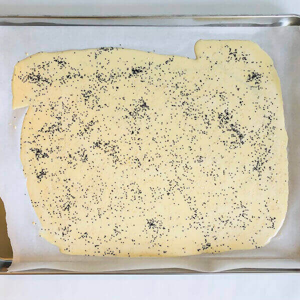 Cracker batter on a baking sheet.