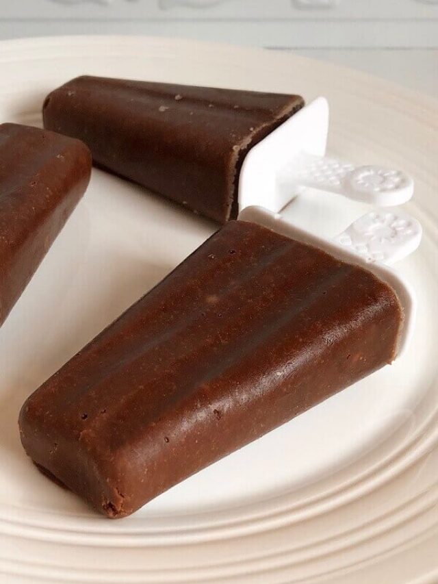 Chocolate popsicles displayed on a plate.