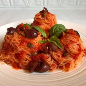 Vegan puttanesca pasta on a plate.