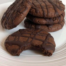 Cookies with chocolate drizzled on top.