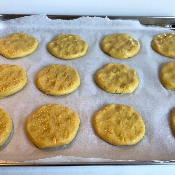 Raw cookies on a tray.