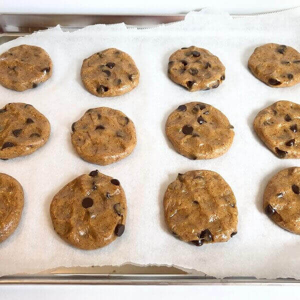 Raw cookies on a baking tray.