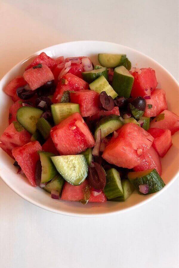 Chopped fruit salad in a bowl.