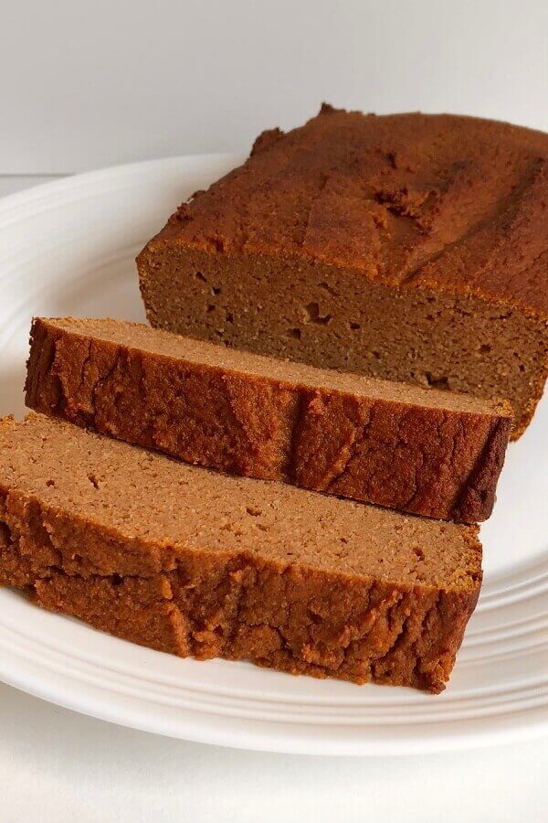 Pumpkin loaf displayed on a white plate.