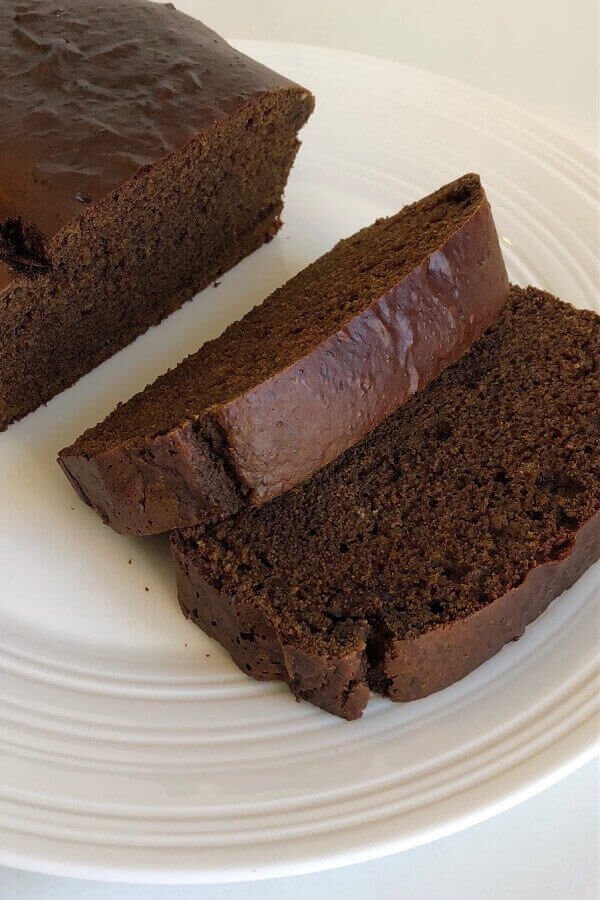 Thick slices of gingerbread on a white plate.