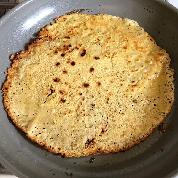 A tortilla in a frying pan.