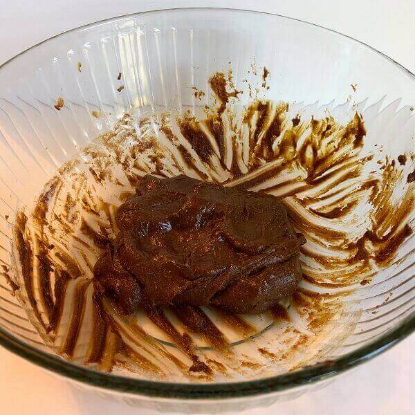 Gingerbread cookie dough in a glass bowl.