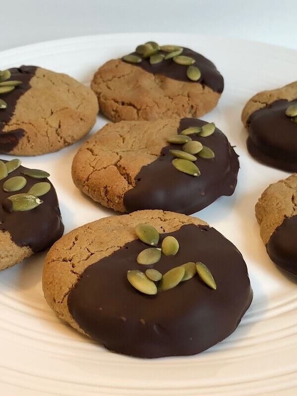 Chocolate dipped cookies on a plate.