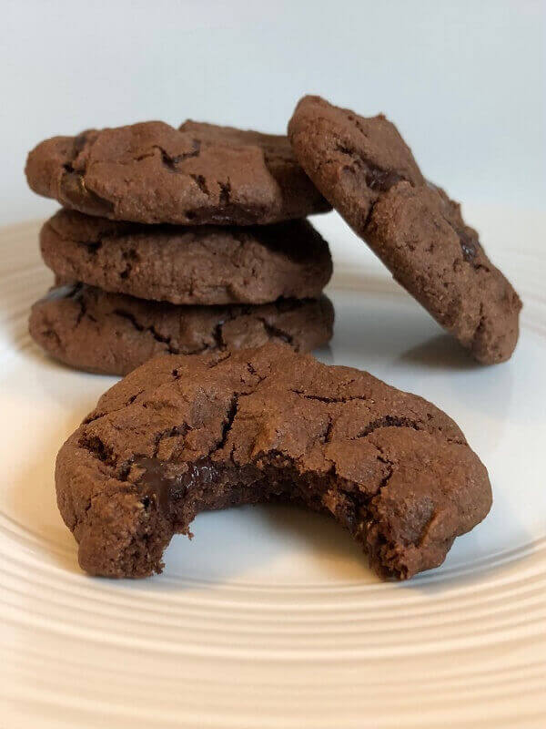 Cookies stacked on a white plate.