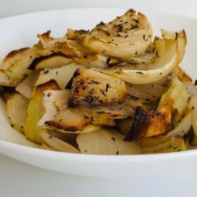 Golden brown onions in a dish.