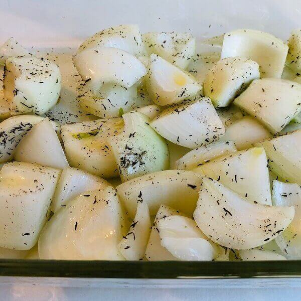 Onions in a glass baking dish.