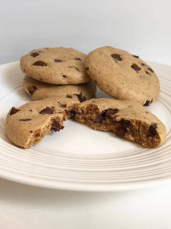 Four cookies on a white plate.