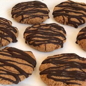 Cookies drizzled with dark chocolate.