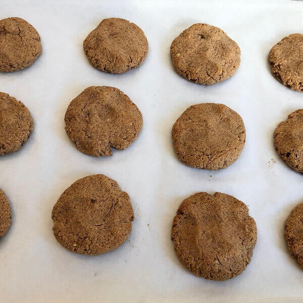 Freshly baked cookies on a sheet pan.