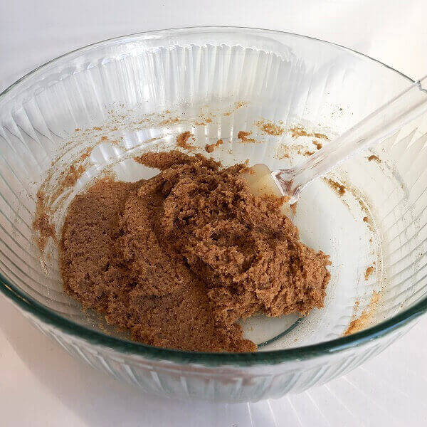 Banana cookie dough in a glass bowl.