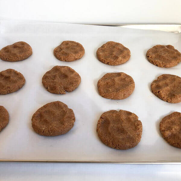 Raw banana cookies on a sheet pan.