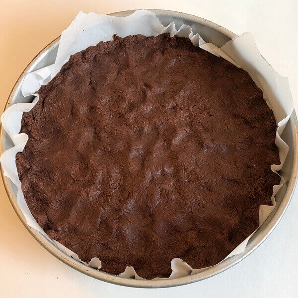 Raw bean cake batter in a baking pan.