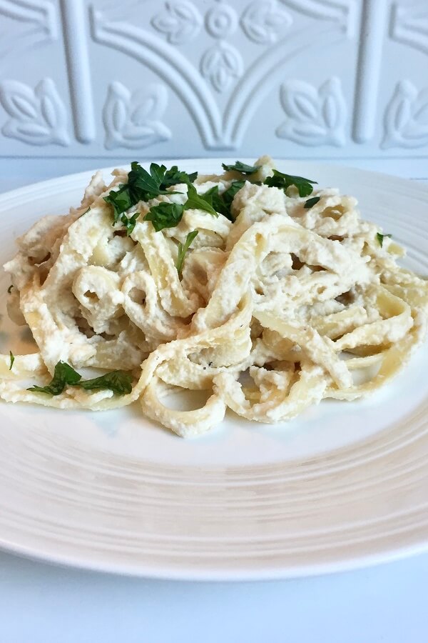 Fettucine alfredo on a plate.