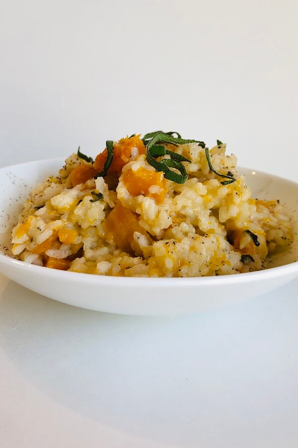 Vegan risotto in a white bowl.