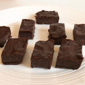 Freezer fudge squares on a white plate.