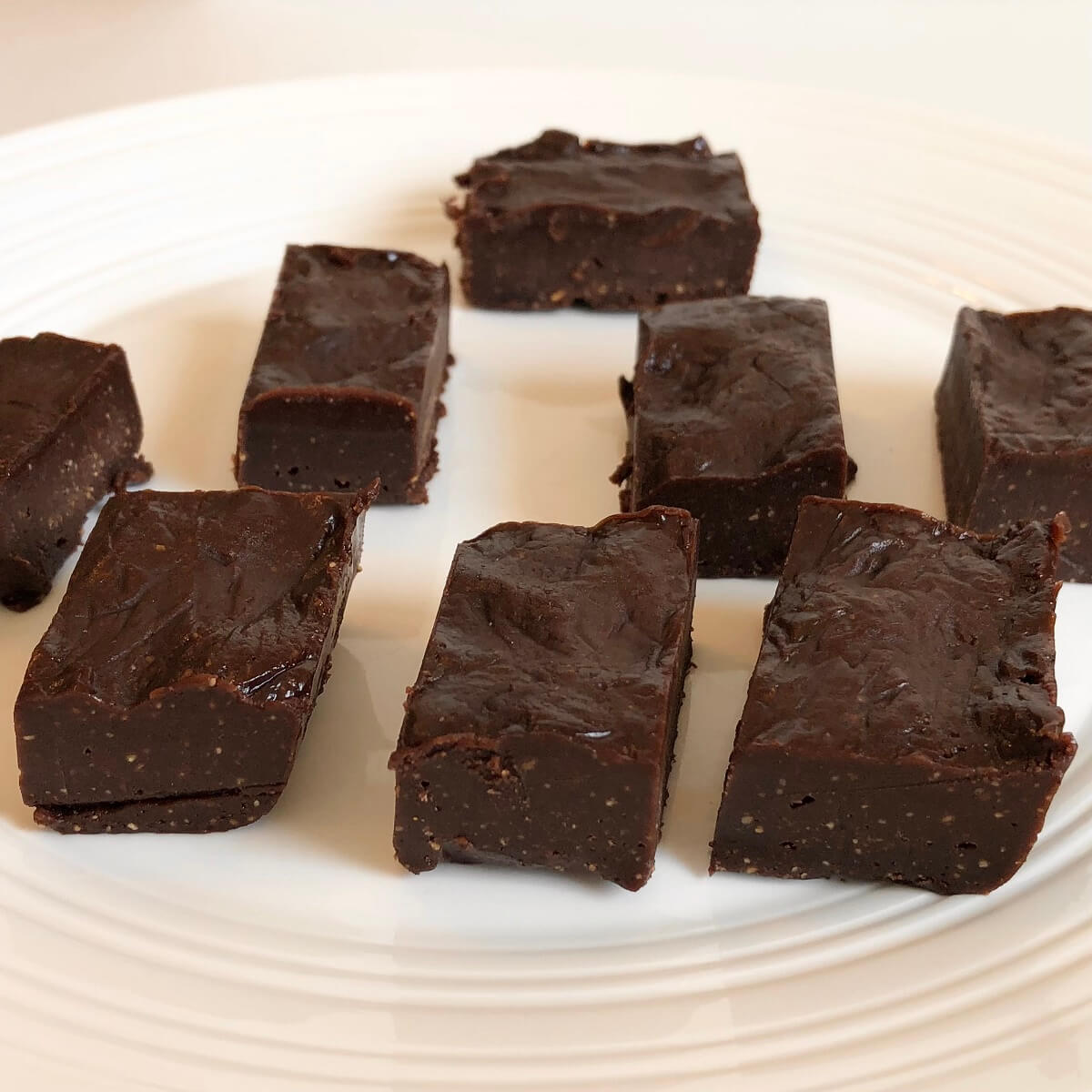 Fudge squares on a white platter.