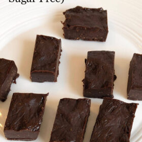 Chocolate fudge cut into squares on a plate.