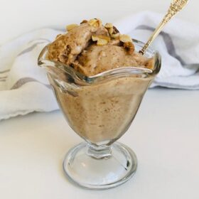 Banana bread ice cream with walnuts sprinkled on top.