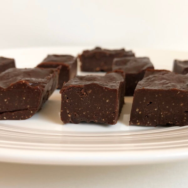 Thick slices of fudge on a white plate.