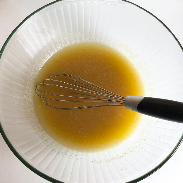 Ingredients for muffins being whisked in a bowl.