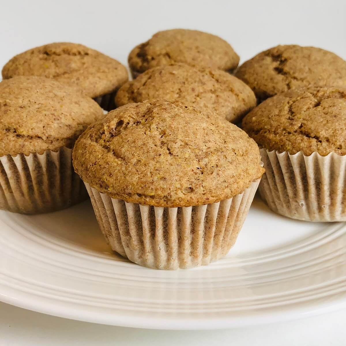 Flaxseed muffins on a white plate.